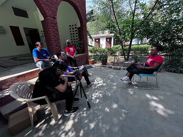 Outdoor interview shoot in a shaded courtyard